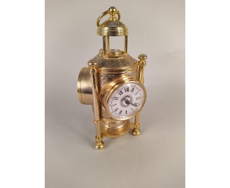 A 20th Century gilded brass table multi faced clock, thermometer and barometer