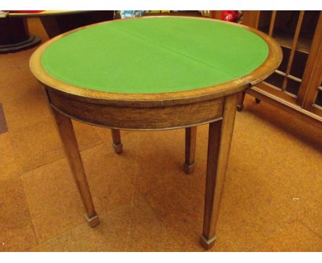 Good quality early 20th century oak demi lune card table with folding top on tapering supports and spade feet