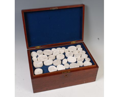 A large collection of late 18th / early 19th century Grand Tour plaster intaglios, many depicting portrait busts of notable f