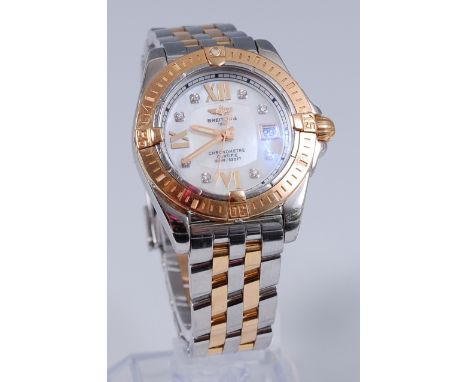 A Breitling ladies steel and 18ct gold bracelet chronometer, having signed diamond set mother of pearl dial, with date apertu
