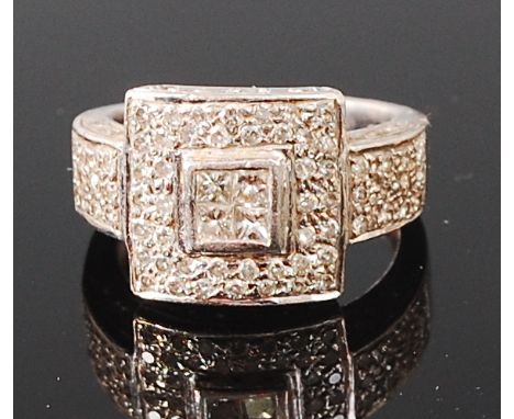 An Art Deco platinum and diamond set dress ring, illusion set to the centre with four princess cut diamonds, within a surroun