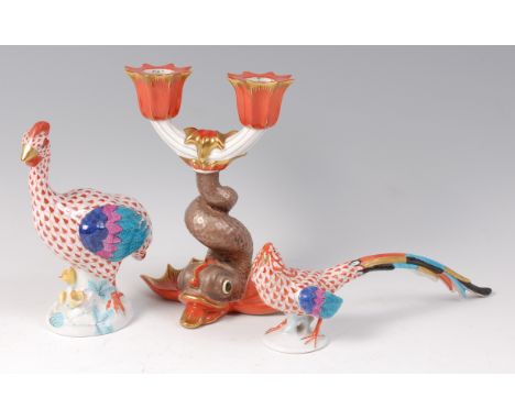A Herend of Hungary porcelain candelabra, in the form of a koi carp, enamel decorated and heightened in gilt, printed backsta
