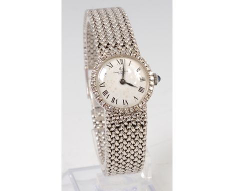 A ladies Baume & Mercier 18ct white gold bracelet watch, having signed white enamel dial with Roman numerals and within diamo