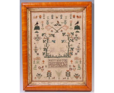 An early 19th century needlework picture sampler, by Mary Ann Cousens, dated 1821, signed to the centre amidst animals, birds