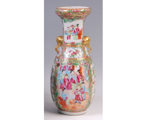 A 19th century Chinese Canton porcelain vase, of slender baluster form, enamel decorated with opposing reserves of ceremonial