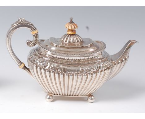 A Regency style silver bachelors teapot, of half reeded oval baluster form, having ivory finial and insulators, 11.3oz, maker