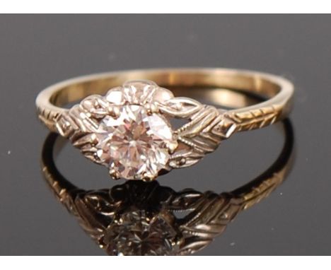 A yellow metal diamond solitaire ring, the claw set brilliant weighing approx 0.5ct, to a chased shank, size M/N   Condition 