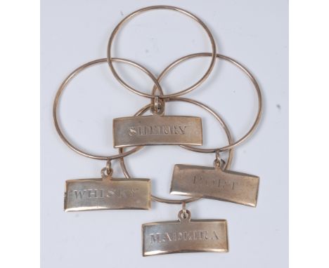 A set of three early 19th century Irish silver decanter rings, with annotated collars, maker WN; together with a matching Eng