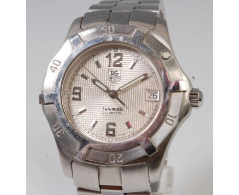 A gents Tag Heuer steel cased automatic wristwatch, having signed engine turned silvered dial, with date aperture, Arabic num