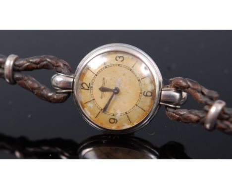 An early 20th century Jaeger LeCoultre platinum ladies wristwatch, having signed enamelled dial (with crazing and discolourat