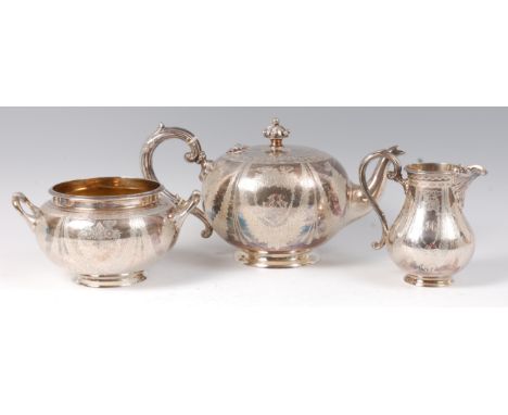 A Victorian silver three piece teaset, comprising; teapot, twin handled sugar, and cream, each of globular form with bright c