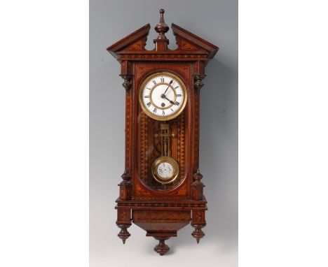 A late Victorian Tunbridge marquetry inlaid Vienna style wall clock, of small proportions, having a broken architectural pedi