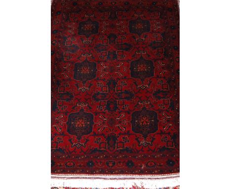 A Persian fineweave Bokhara prayer rug, the red ground having two rows of shaped medallions and kelim flatweave end, 98 x 132