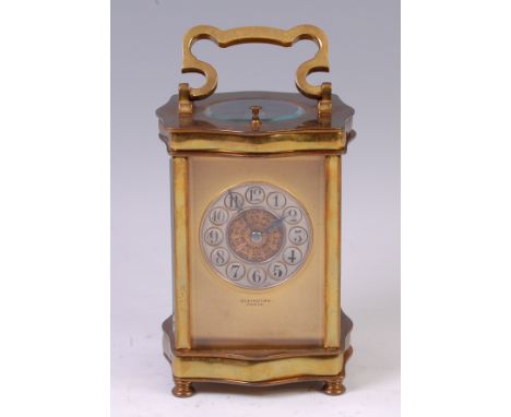 A circa 1900 French lacquered brass carriage clock, by Elkington & Co, with repeat, the serpentine shaped case with scroll ha