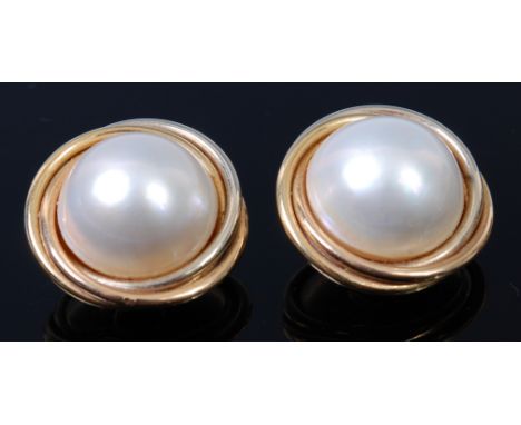 A pair of modern Mappin & Webb 18ct gold and pearl set ear clips, each split pearl is gold backed and in a ringed surround, w