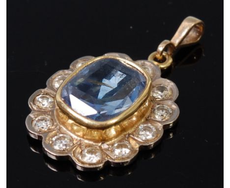 An antique sapphire and diamond set pendant, the oval cut sapphire weighing approx 2.75ct, within a surround of twelve old br