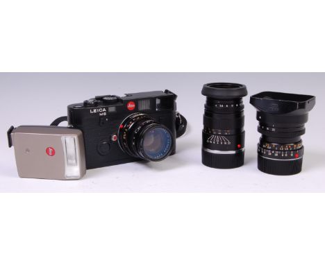 A Leica M6 black body camera, with a Summicron-M 50mm F2 black lens, an Elmarit-M 28mm F2.8 black lens, an Elmar-C 90mm F4 bl