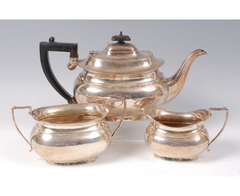 A Regency style silver three piece teaset, comprising; teapot, twin handled sugar, and cream, each of oval bombe form, gross 