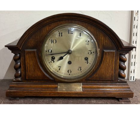 An early 20th Century oak mantel clock 