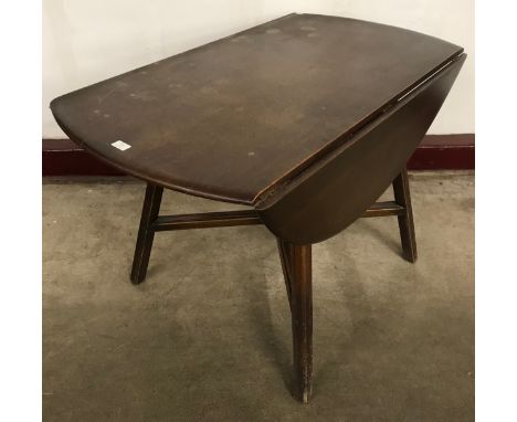 An Ercol Golden Dawn elm drop leaf table 