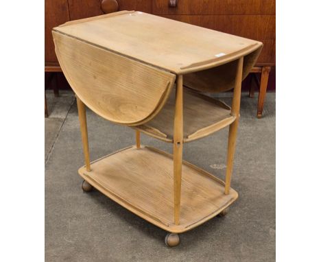 An Ercol elm and beech Windsor trolley 