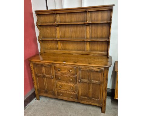 An Ercol Golden Dawn elm dresser 