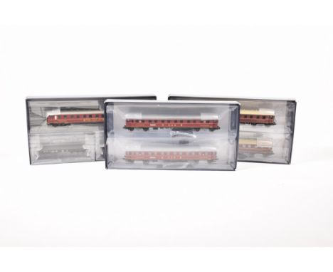 Three boxed Lilliput by Bachmann twin coach setsComprising no's. L352000, L382803 and L382801, one containing coaches in maro