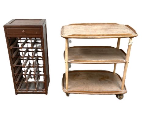 An Ercol ash wood three tier serving trolley, 71cm wide; also an 18 bottle wine rack, with corkscrew drawer, 80cm high; and a