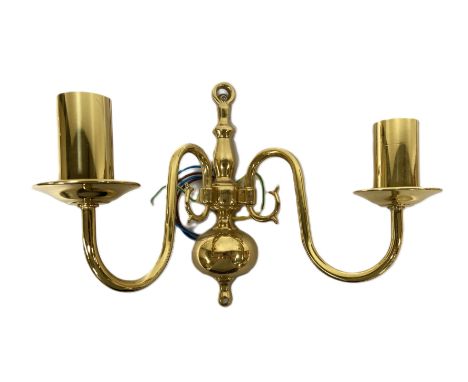 A set of four gilt metal twin light wall fittings, with scroll arms