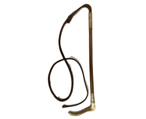 A vintage riding whip, circa 1930, with horn handle and leather shaft and woven whip