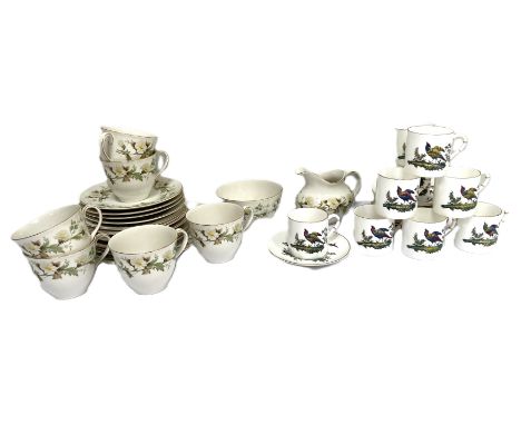 A Royal Worcester bone china part coffee service, decorated with peacocks and pheasants, with 12 saucers and 9 coffee cans; a