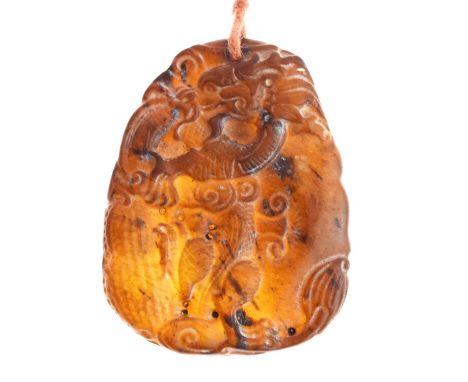 Chinese carved brown jade pendant, modelled with a dragon and lingzhi (mushroom), 48mm high