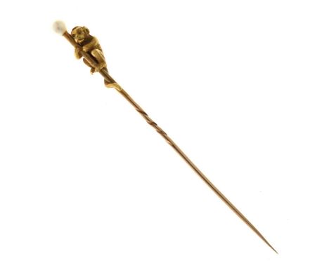 Late Victorian/ Edwardian yellow metal stick pin modelled as a monkey, white pearl terminal, pearl diameter 3.5mm approx, len