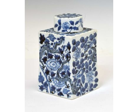 Chinese porcelain blue and white caddy, of gently tapered square form with cylindrical neck and cover, decorated with dragons