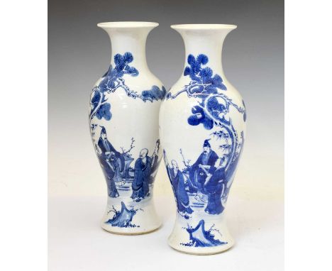 Pair of Chinese Qing Dynasty blue and white porcelain baluster vases, 19th century, of two-part construction, decorated as a 