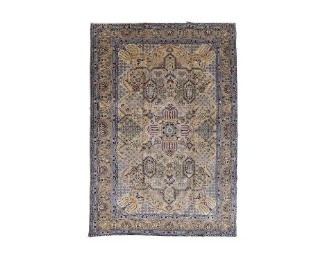Central Persian Kashan rug or carpet, the sage-green field with central medallion, flowerhead clusters and panels, within con