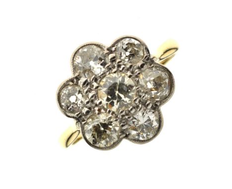 Diamond 18ct yellow gold and platinum flower head ring, seven round brilliant cut diamonds, total diamond weight 1.10 carats 
