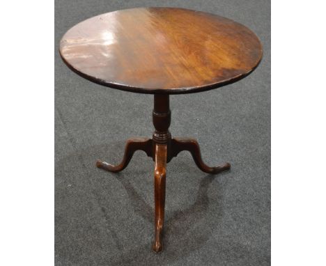 A 19th Century mahogany snap top supper table of circular form, raised to a turned pedestal support over a tripod base, diame