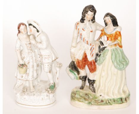 Two 19th Century Staffordshire flat back figures, the first modelled as a lady and gentleman stood on an oval base, he leanin