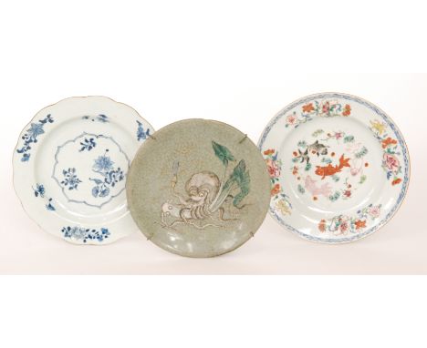 Two late 19th Century Chinese plates, the first decorated with enamel fish to the central well with a border edge of flowers,