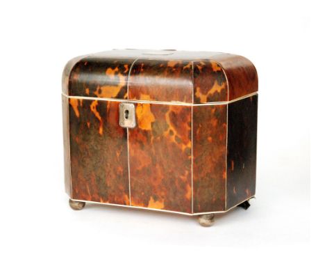 A 19th Century tortoiseshell tea caddy of rectangular outline with canted corners and ivory stringing, the shallow domed lid 