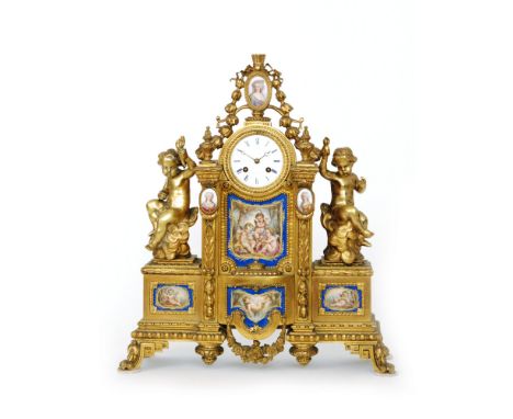 A late 19th Century French gilt mantle clock with eight day striking movement, the circular white enamelled dial signed 'Leno