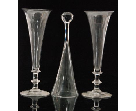 A pair of 19th Century ale glasses with a spread foot below a plain form stem with a central and upper bladed knop rising to 