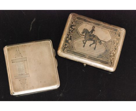 A Russian silver niello work rectangular cigarette case, the lid with figure on horseback, engraved cartouche to the back 'WR