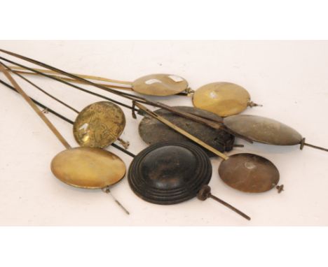 A small collection of longcase and wall clock pendulums. (qty)