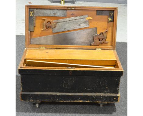 A pine carpenters tool chest and assorted tools.