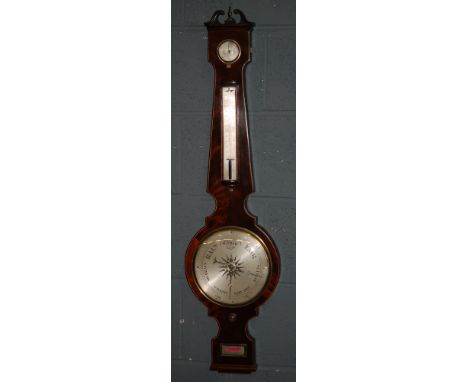 A 19th Century inlaid wheel barometer with silvered circular dial incorporating dry/damp dial and thermometer, height 97cm