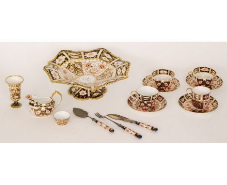 A collection of assorted Royal Crown Derby comprising a large wavy edge comport, three saucers, three cups of varying shape, 