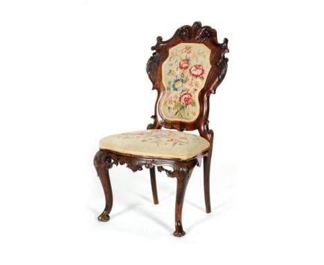 A Victorian rosewood side chair, with an acanthus scroll frame and cabriole front legs, with tapestry upholstered seat, later