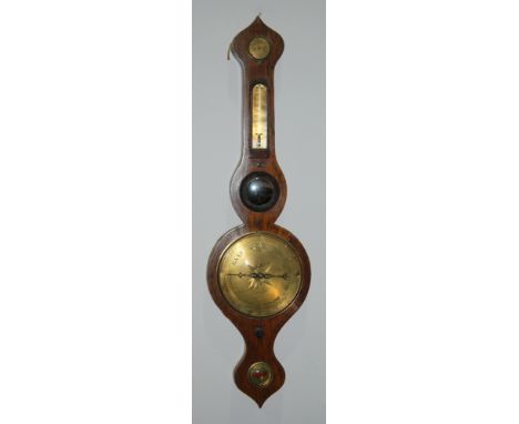An early 20th Century rosewood wheel barometer with brass register, thermometer and dry/damp dials all within a stencilled fo